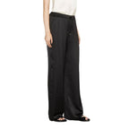 Trousers with an elastic insert