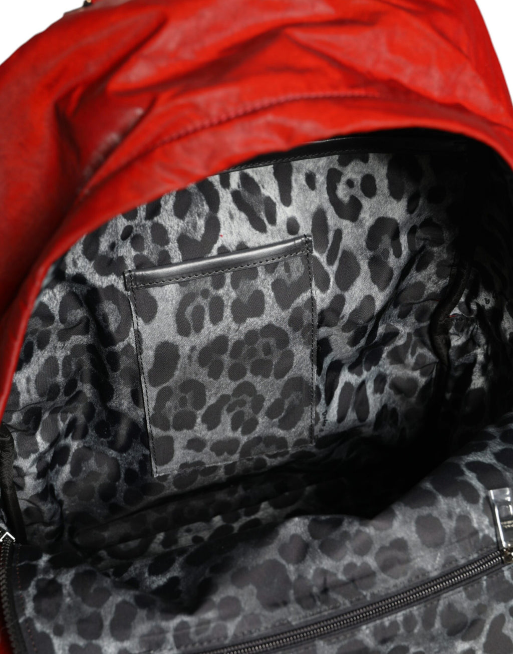 Backpack with red patent leather logo