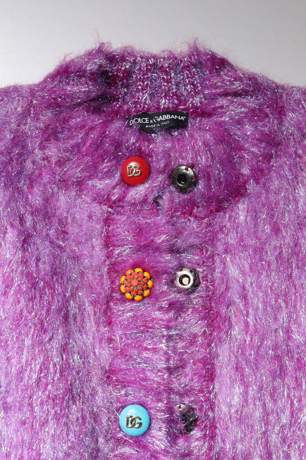 Trench coat with decorative purple buttons