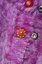 Trench coat with decorative purple buttons