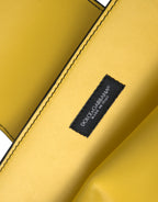 Yellow leather clutch/shoulder bag with DG logo
